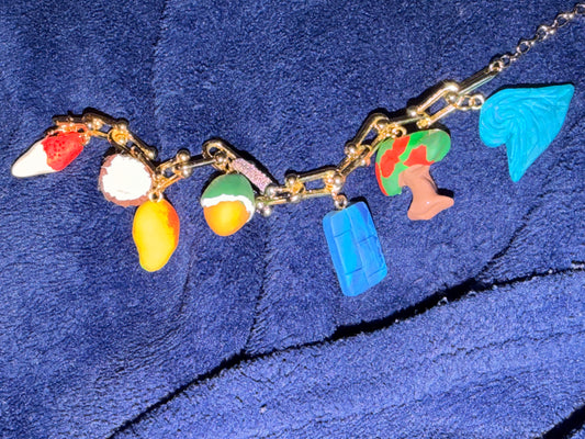 Los colores de mi Tierra charm bracelet. Stainless steel 316L Gold plated 18K with zirconia and polymer clay charms.