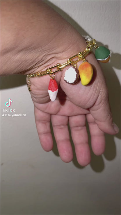 Los colores de mi Tierra charm bracelet. Stainless steel 316L Gold plated 18K with zirconia and polymer clay charms.